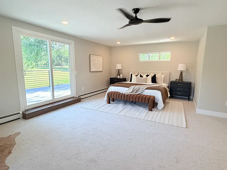 Spacious primary bedroom, French doors to upstairs south-facing deck