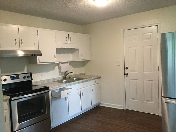 Kitchen with a view of the back door.
