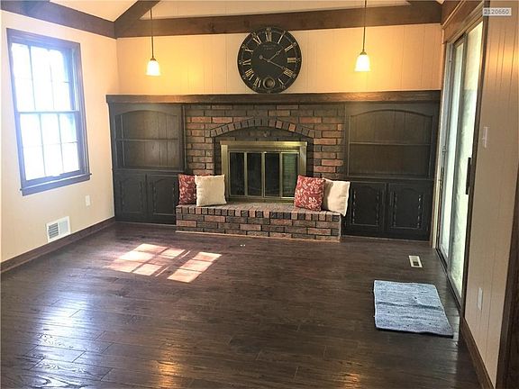 Built-ins surround the gas fireplace.  Vaulted ceiling adds space.