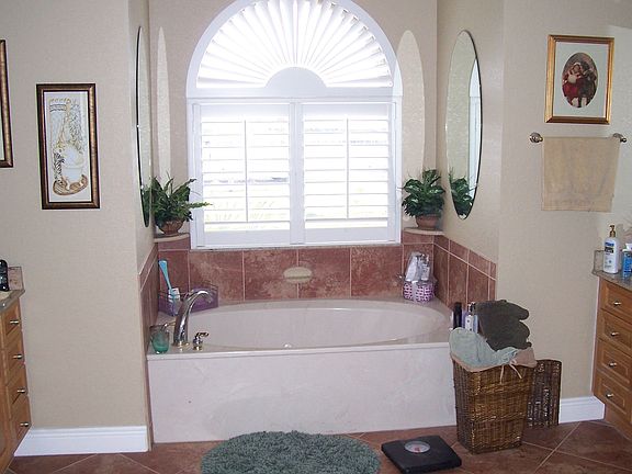 Master Bath With His and Her Sinks and Closets