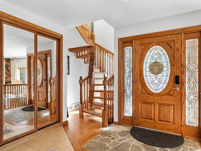 Entry way and look at spiraling staircase to the second floor