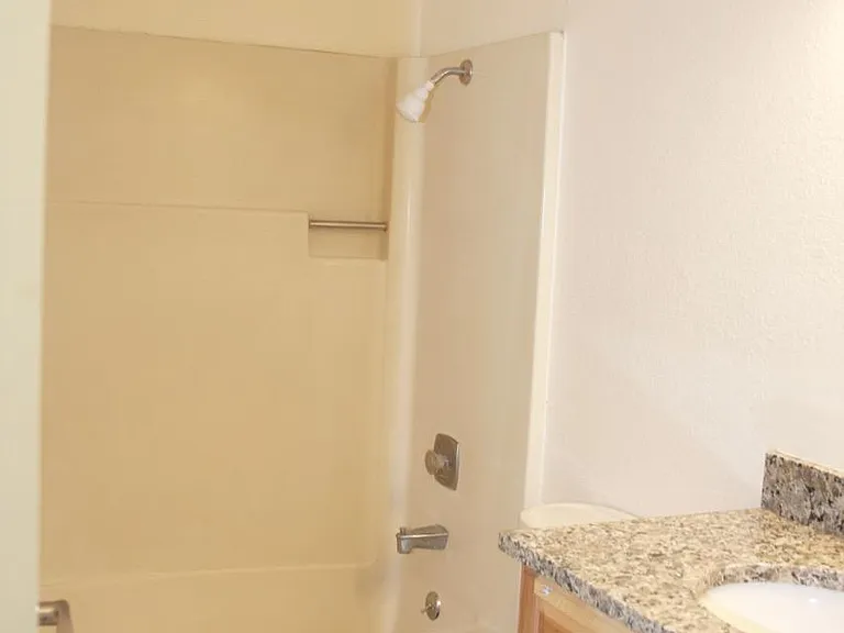 Bathroom updated in 2018, with new hickory vanity, new granite countertop, new satin nickel faucet.