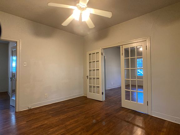 Dining room looking into living room on right and back bedroom on left