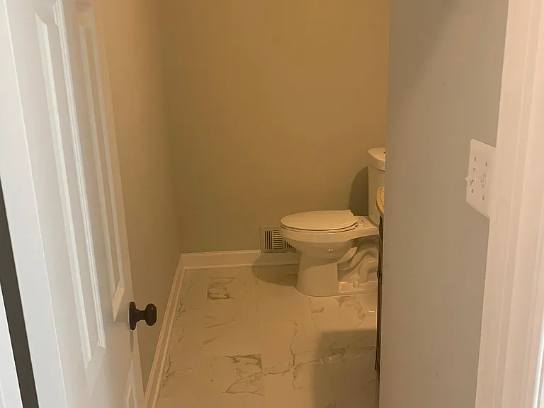 Main Level Power Room with New Tiles.
