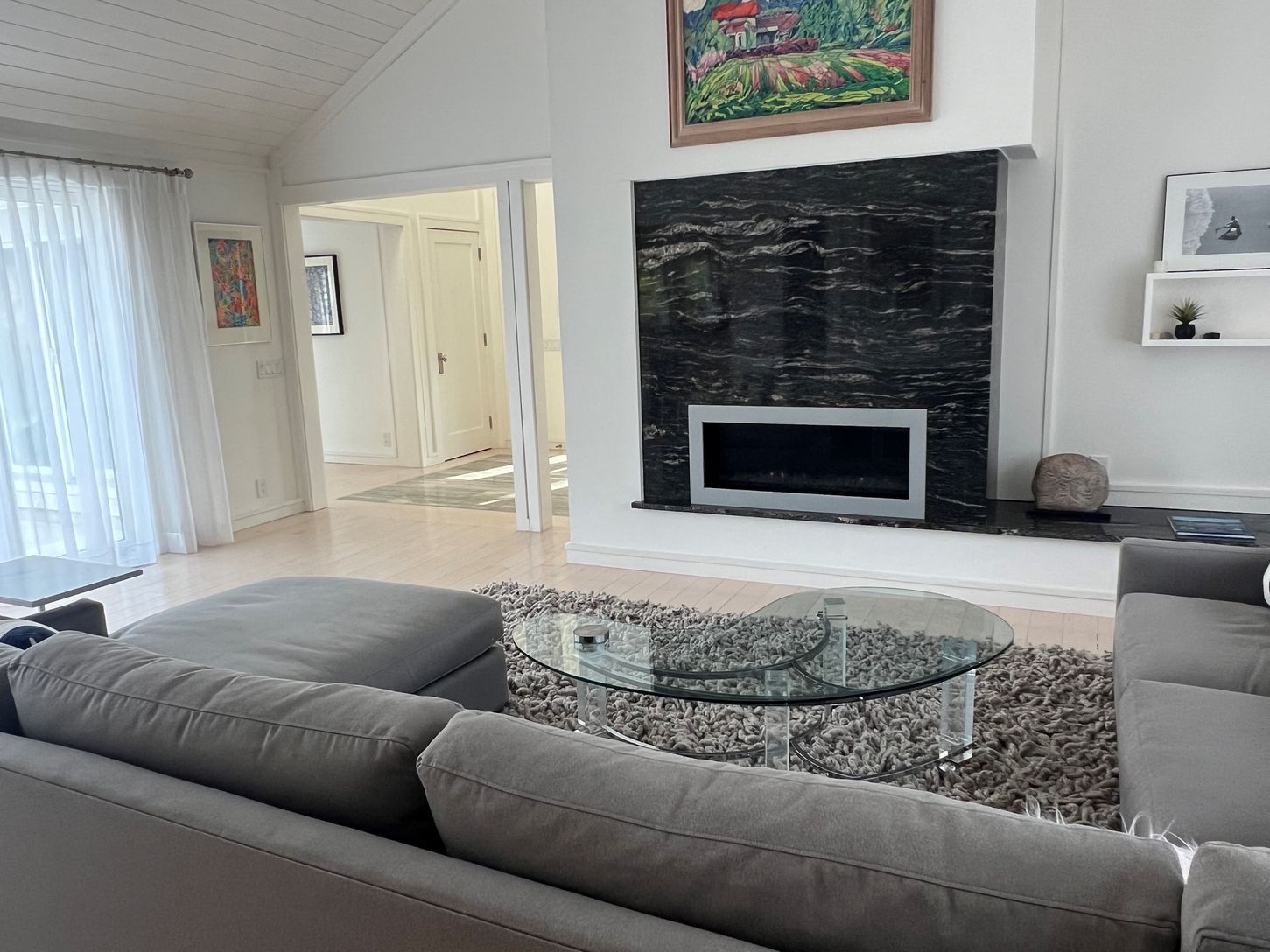 large, sectional sofa in the living room with gas fireplace.