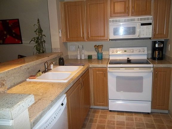 Good sized kitchen overlooks dining & living area. All appliances stay...good cabinet space.