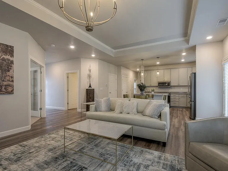 The Cardiff- Great Room/Living Area Open to Kitchen w/ Access to Private Patio