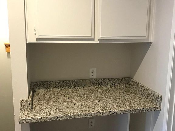 Granite-topped built-in computer desk
