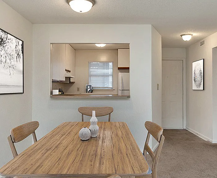 Experience the seamless connection between the dining area and kitchen in this stylish apartment.