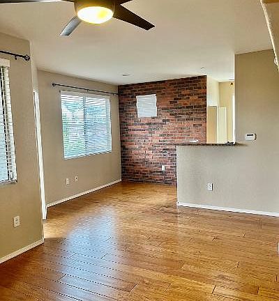 View of the living and dining room. Hardwood floors throughout.