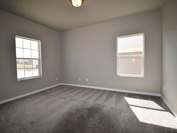Front room makes for a great office or reading area