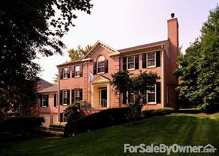Front elevation
						:
						Sunrise view, dual fireplace stacks, mature landscaping, weed-free lawn