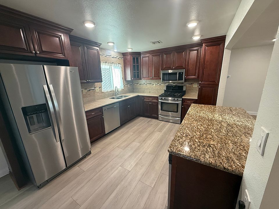 Kitchen including Fridge, Dishwasher, Trash Compactor, Stove, Microwave