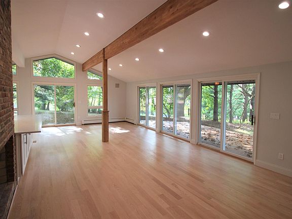 House # 1 - Vaulted Living Room with many sliders to deck.