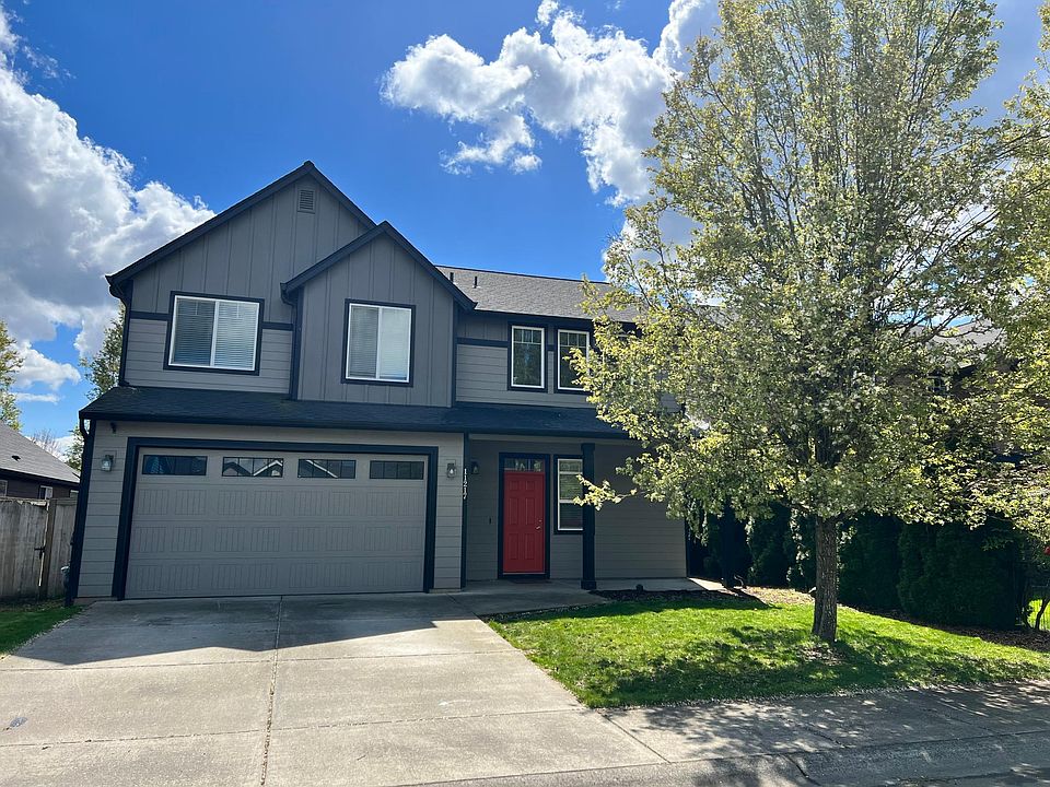 Attractive grey two-tone paint with red door.
