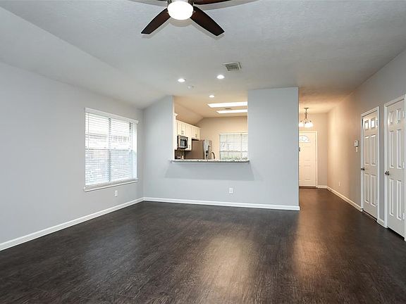 The open concept floorplan has a large dining space with a serving bar.