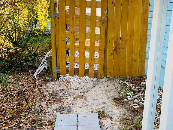 Private entry gate which leads to private courtyard and stairs to unit.
