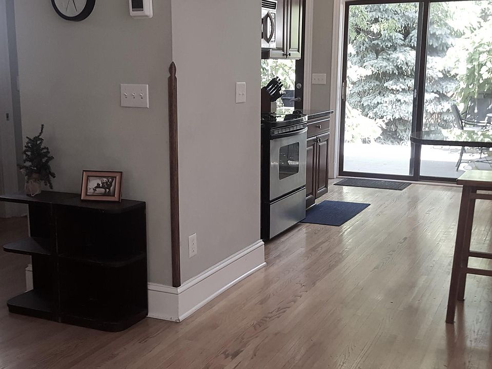 KITCHEN OPENS TO DECK AND DEN ON THE LEFT