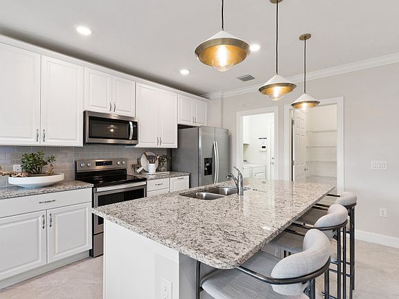 Open kitchen with center island and dining space