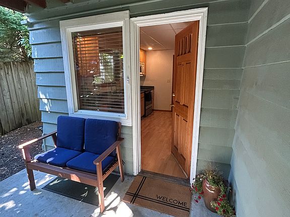 Covered, private entrance opens into the kitchen.
