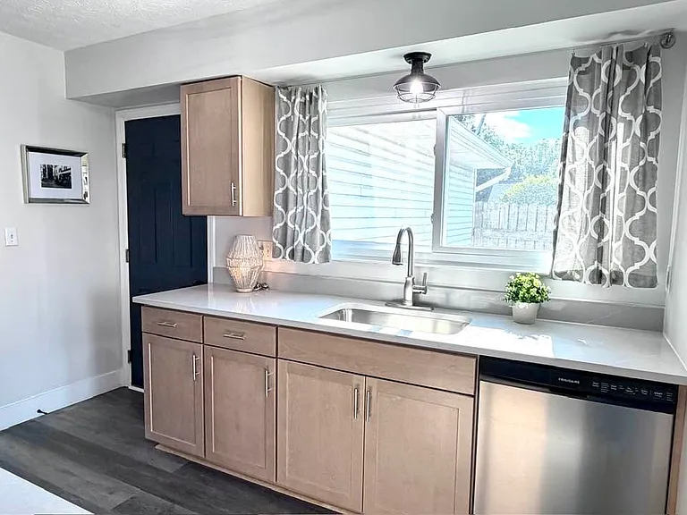 All new kitchen with quartz countertops and stainless appliances