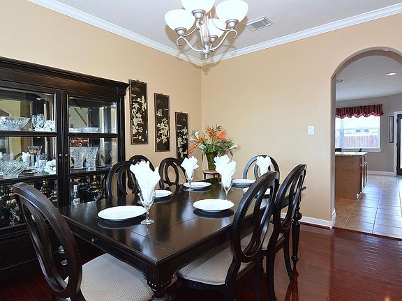 Another view of the dining room. The kitchen is just past the arched doorway.