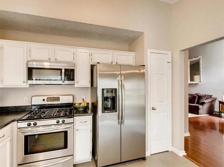 Kitchen with stainless steel appliances.