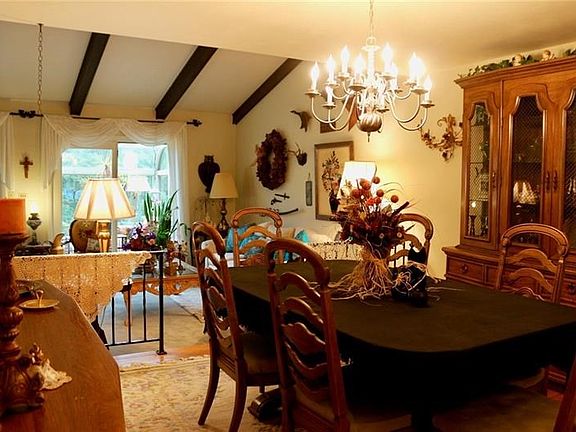 Brass light fixture in the Dining Room sits 8 comfortable.