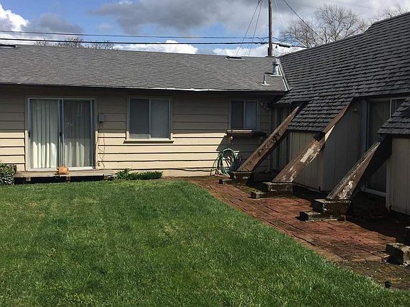Backyard looking back at the house showing the A-frame bonus room on the right