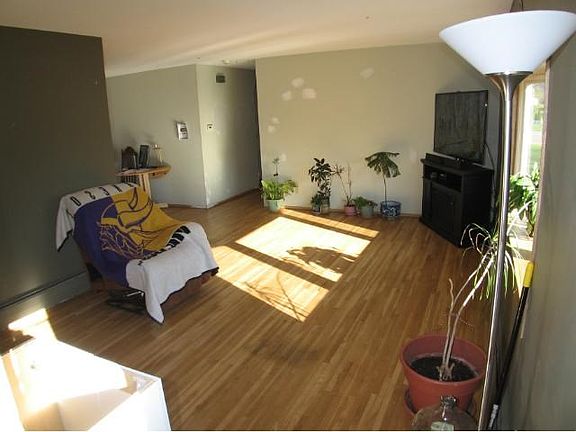 Living room features a newer bay window.