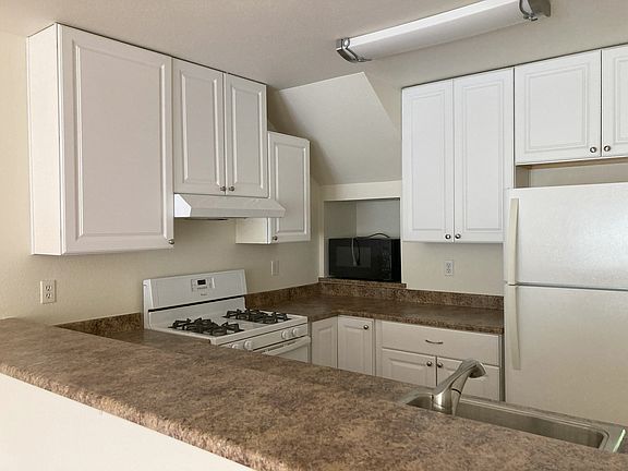 Kitchen, large microwave in wall cutout to save counter space