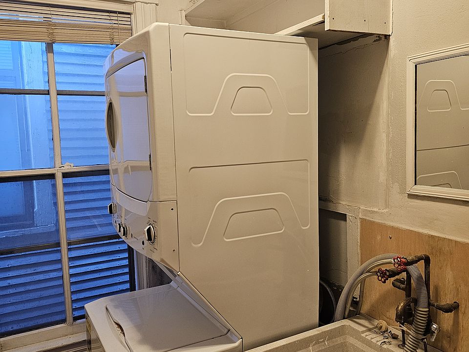 Laundry with storage space, along within unit washer and dryer