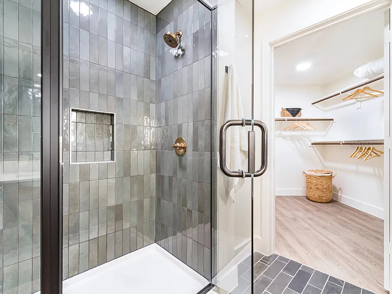 Enjoy sleek tile showers and oversized closets at Modera St. Paul, where refined finishes and thoughtful details elevate everyday living in Dallas.