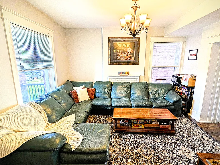 Living room furnished with vintage, sectional sofa.