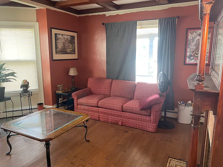 Living room, front window looking out on porch.