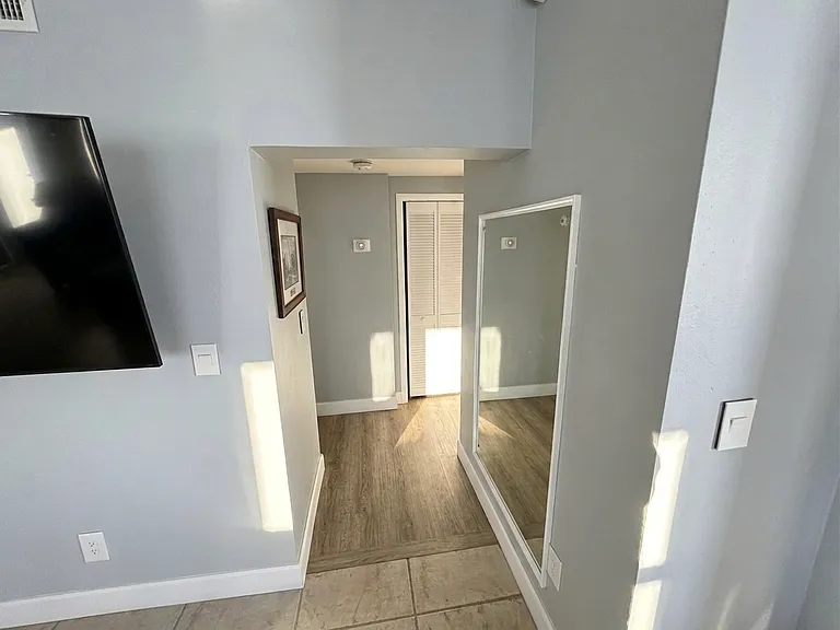 Hallway/Entry
Airy entryway with soaring ceilings, natural light, and closet storage _ a welcoming first impression