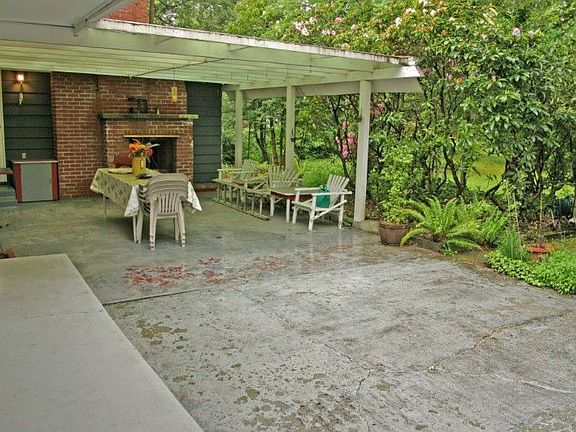 Wonderfully private backyard patio with uncovered and coverd space, and an outside fireplace for coz