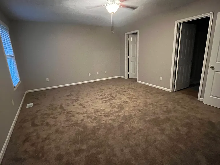 Another view of primary bedroom