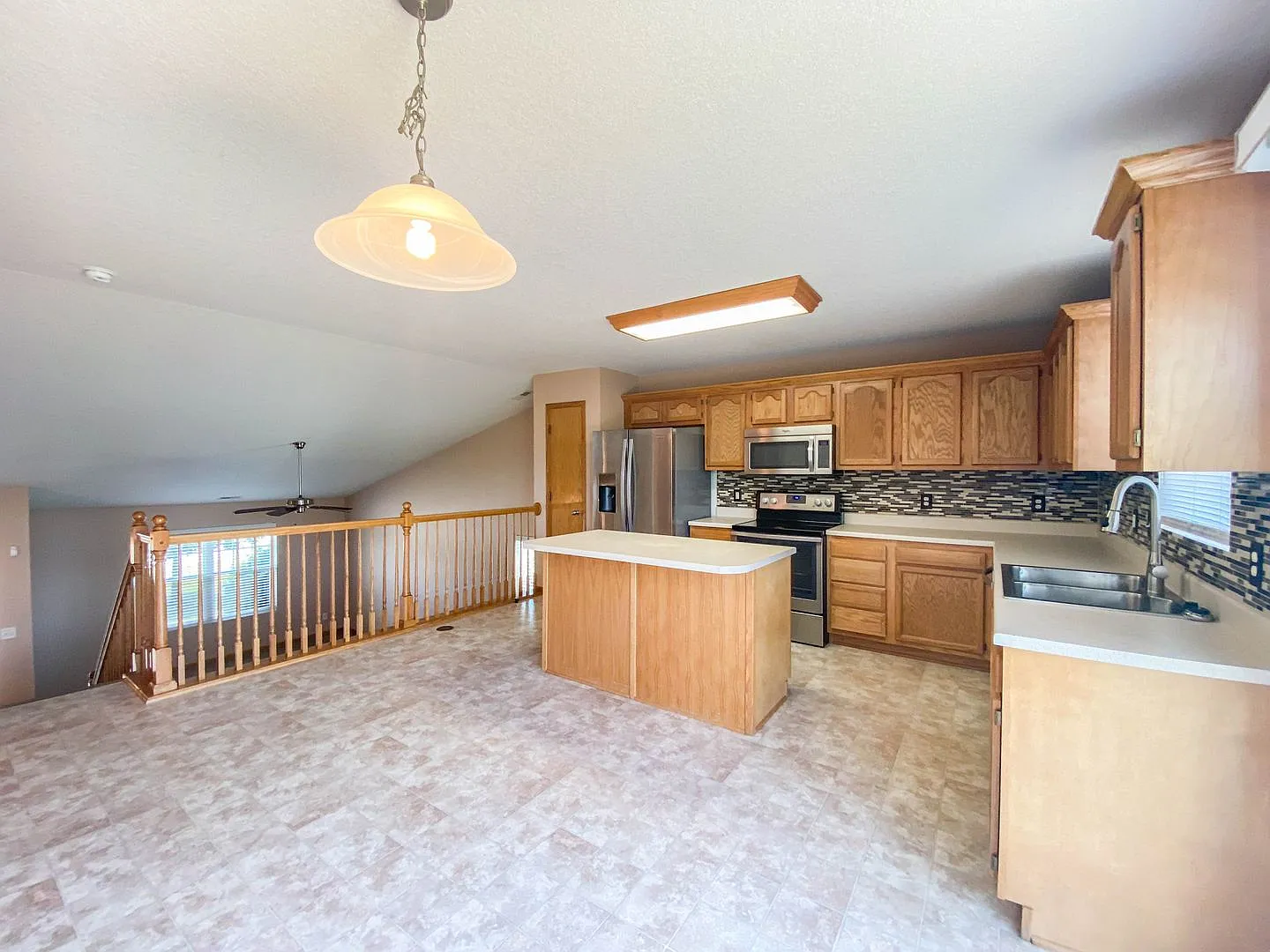 Spacious 3-Bedroom Waukee Home with Fenced Yard, Deck & 2-Car Garage — Photo 3