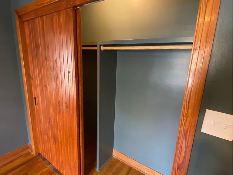 Custom made sliding closet doors in bedroom 1.