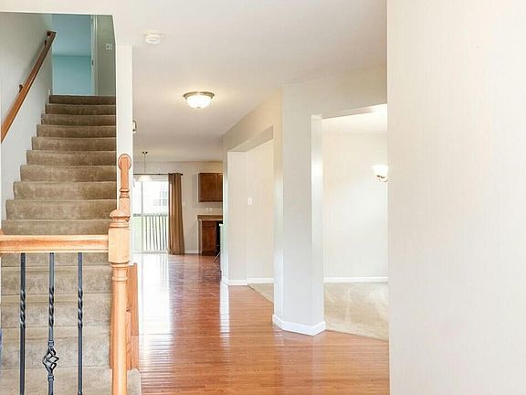 Entry Way that Leads Towards the Kitchen with Office and Dinning Rooms to the Right or Upstairs to the Loft Area and Bedrooms