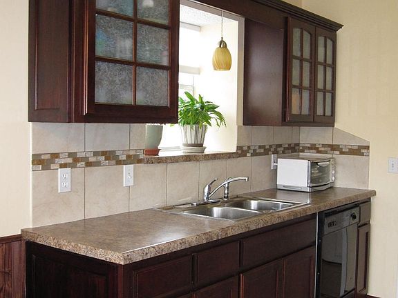 Rich Cherry Wood accented with decorative light fixture