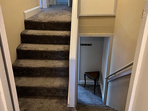 Stair way up to the 3 bedrooms down to the living room/kitchen