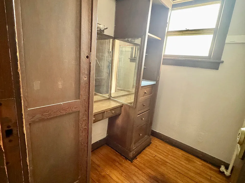 Walk-in closet with built-ins.