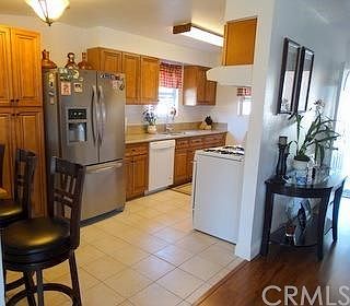 View of the kitchen.  Brand new cabinets, granite, dishwasher, sink, and faucet.