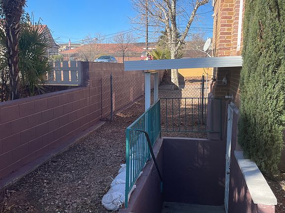 View of entrance and side yard.
