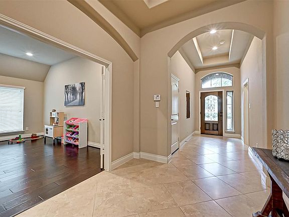 Beautiful arches and tray ceilings accent this home!