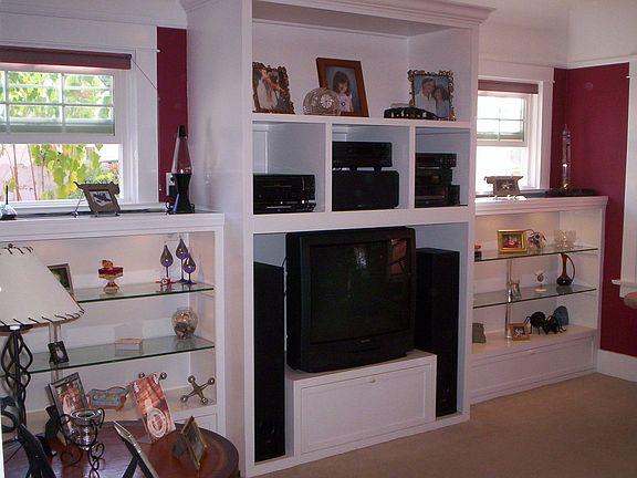 Custom built-in entertainment center w/lighted shelves 