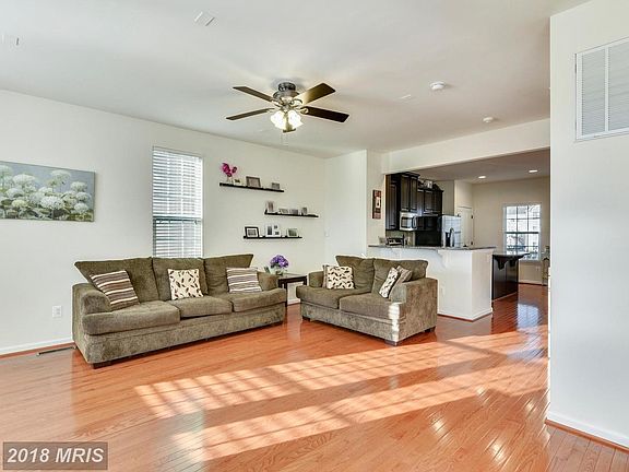LARGE LIVING ROOM WITH HARDWOOD FLOORS