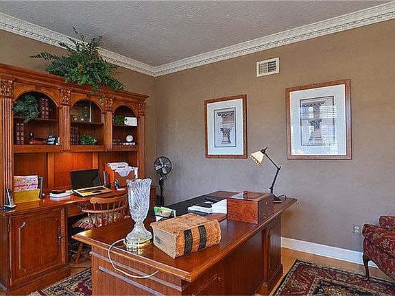 Spacious study is the perfect place for anyone to catch up on business or personal tasks.  Hard wood floors add a touch of elegance.